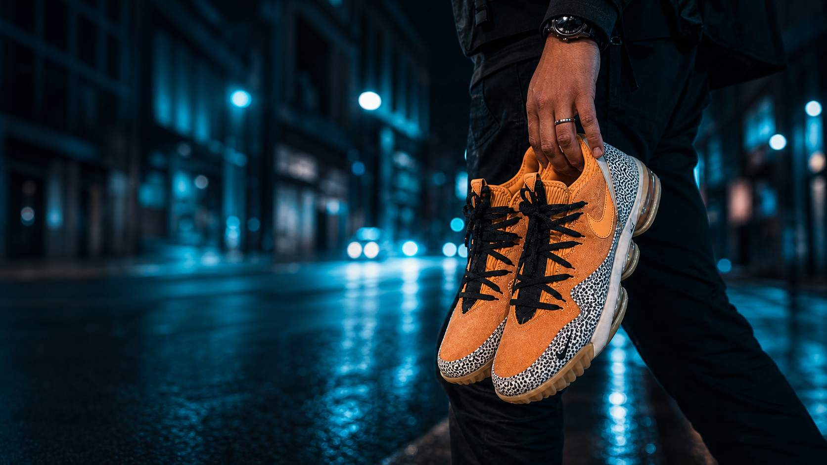 Collector carrying Nike Atmos x LeBron 16 Low Safari sneakers at night